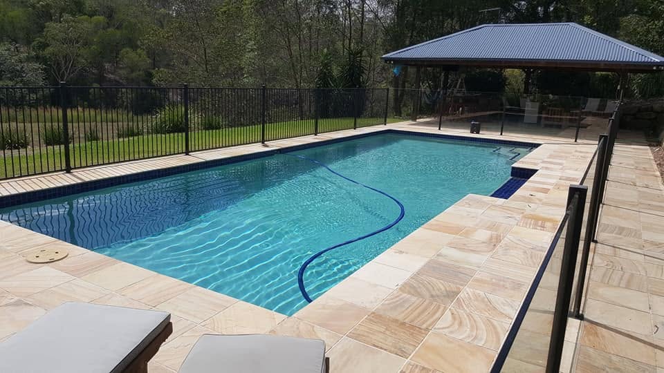 Clean backyard pool with cabana serviced by Pool Fast Services & Repair in Brisbane's south-west